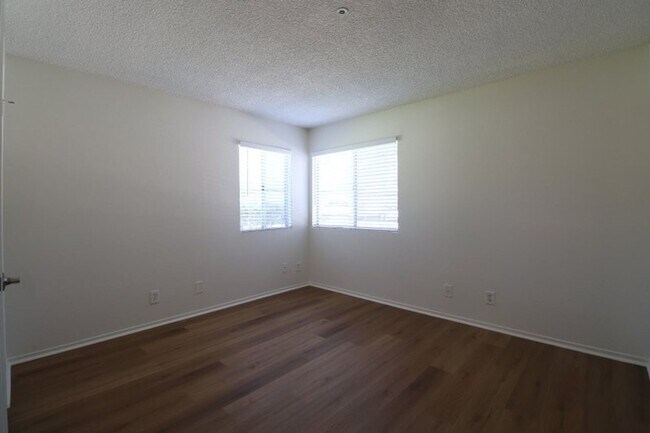 Building Photo - Cozy Condo with Private Patio & Resort-Style Amenities