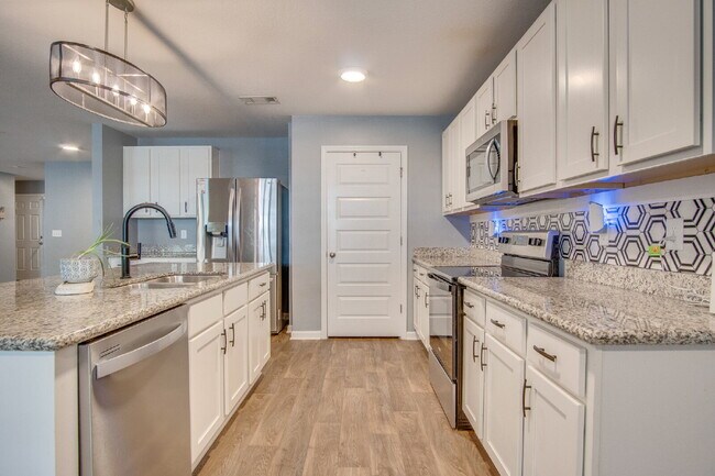 Building Photo - Move In for the Holidays! Heated Saltwater Pool & Tropical Backyard –$500 OFF First Month + Milit...