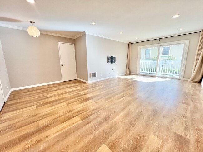 Building Photo - Contemporary 2 Bed Condo with 2 Garage Parking Spaces, Community Pool, and 3 Private Balconies