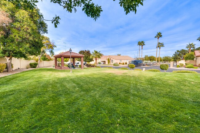 Building Photo - This 4-bedroom, 3-bathroom gem in a gated ...