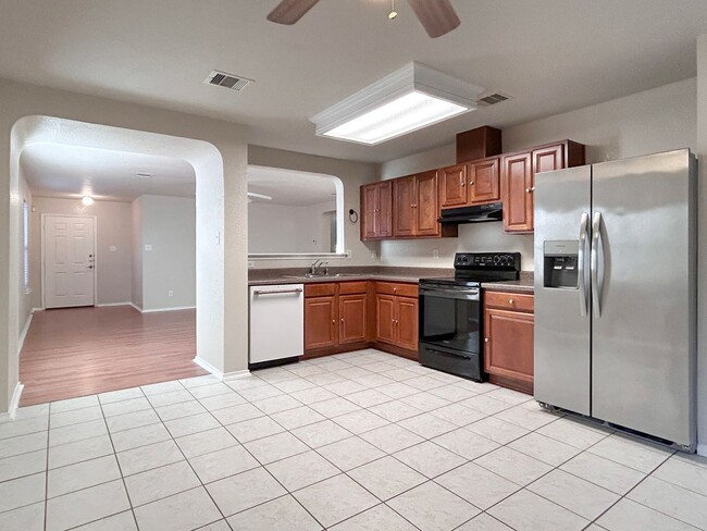 Building Photo - Northeast 3/2 with New Bedroom Floors & Covered Patio