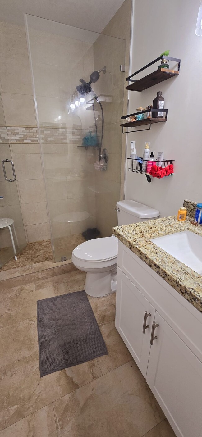 Remodeled bathroom with closet storage - 10650 SW 157th Ct