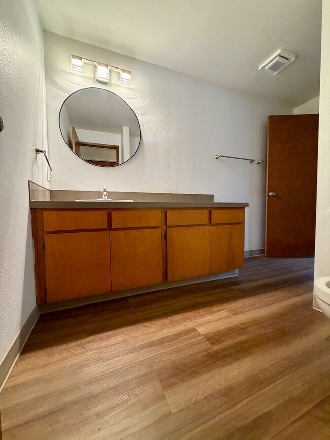 Building Photo - Updated Townhouse in the Heart of Garden Home~ New LVP Flooring~ Washer/Dryer Hook-Ups~ A/C~ Larg...