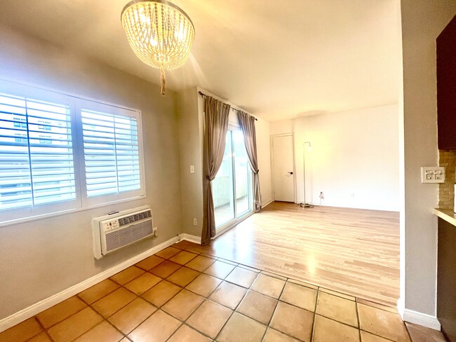 Plantation shutters throughout and drapes for patio - 1325 Wellesley Ave