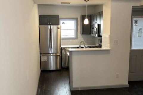 Kitchen w/ side door access to backyard - 2032 Blair St