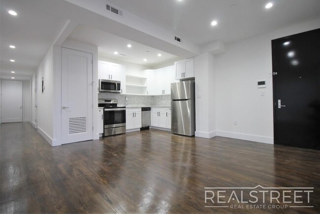 Building Photo - Stunning Giant New 2 BED with GARAGE & W/D...