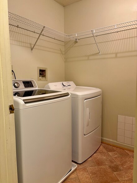 View of washer and dryer from the hallway - 208 Quarter Trl