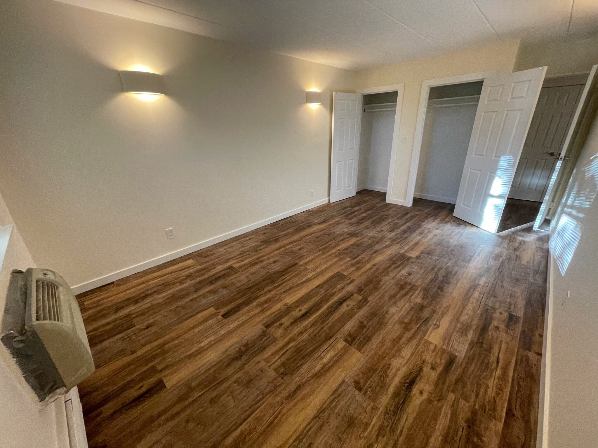 Living room showing extra tall double closets - 27 Northill St
