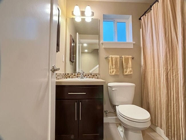 Building Photo - Stylish Greenwood Townhome with Private Patio & Modern Finishes