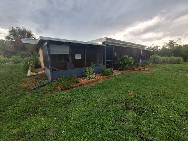Building Photo - Gulf Access Home on Canal Available Now