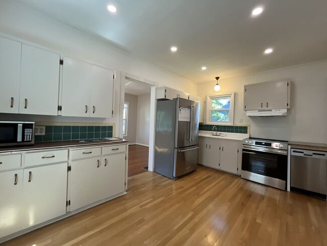 Building Photo - Charming Cottage with Hardwood Flooring, Modern Kitchen & Beautiful Outdoor Living Areas