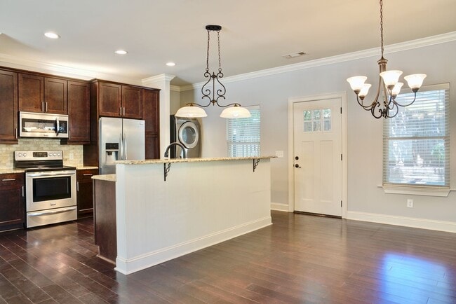 Building Photo - Heisman Villas: End Unit with Parking & Pr...
