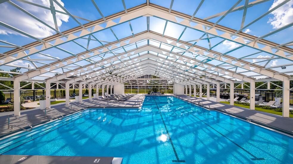 Dive into relaxation in our stunning, enclosed pool. Enjoy a swim or lounge by the water, all while basking in the natural light and beautiful surroundings. - The LINC