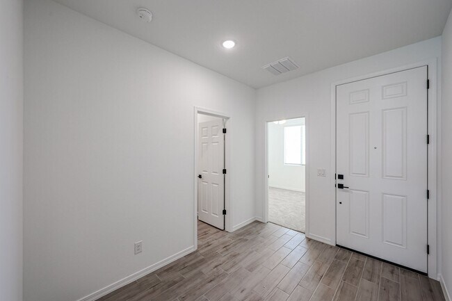 Building Photo - Modern Mountainside Living: Stunning New 4-Bedroom Home in Estrella Crossing! 3 CAR GARAGE!