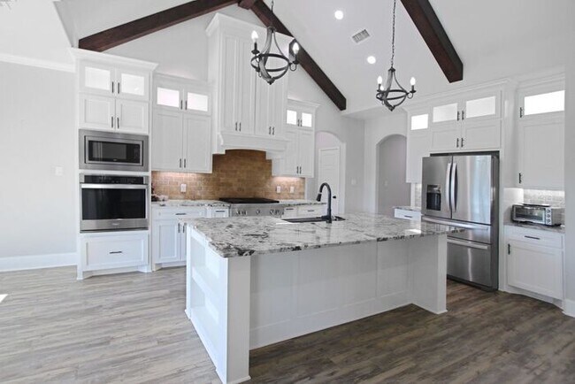 Building Photo - Tour Today! Beautiful 4-Bedroom, 2-Bathroom Home Overlooking a Pond!