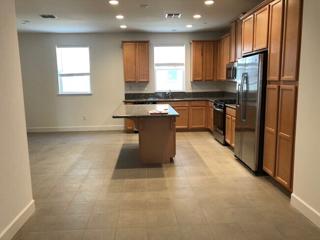 Building Photo - Tri-level Townhome with 2 Car Attached Gar...