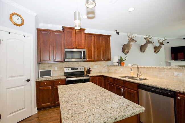 Building Photo - "Spacious 4-Bedroom Gem with 2.5 Baths at ...