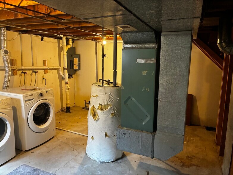 The utilities are also located in the unfinished part of the basement, with ample storage space - 1205 Randolph St
