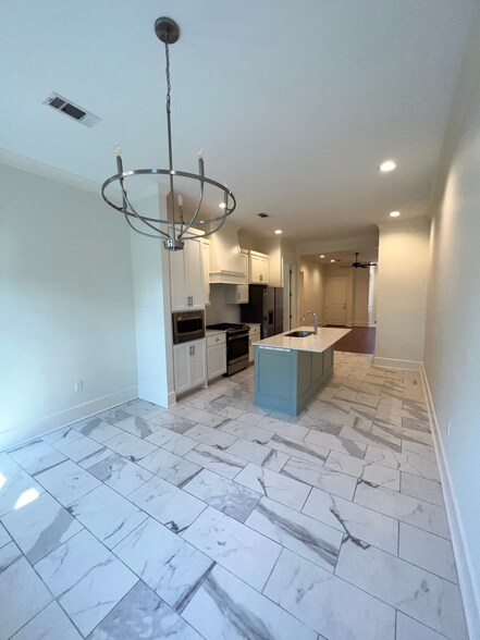 Kitchen facing Entry-way and Front Door - 324 Saint Thomas Ln