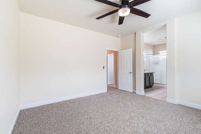 Building Photo - Four bedroom/2-bath home with 2-car garage