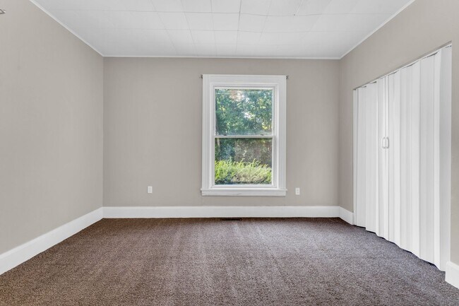 Building Photo - Charming Home with Updates and Covered Porch - A Must-See!