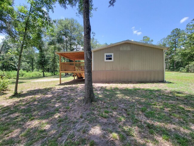 Building Photo - Cozy and Adorable home 4 bedroom 2 bath home on over 1 acre near McRae Lake! Relax on the covered...
