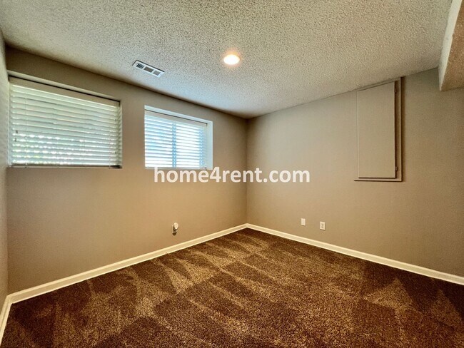 Building Photo - Updated Kitchen, Large Two Tiered Deck, Finished Basement in Blue Valley Schools!