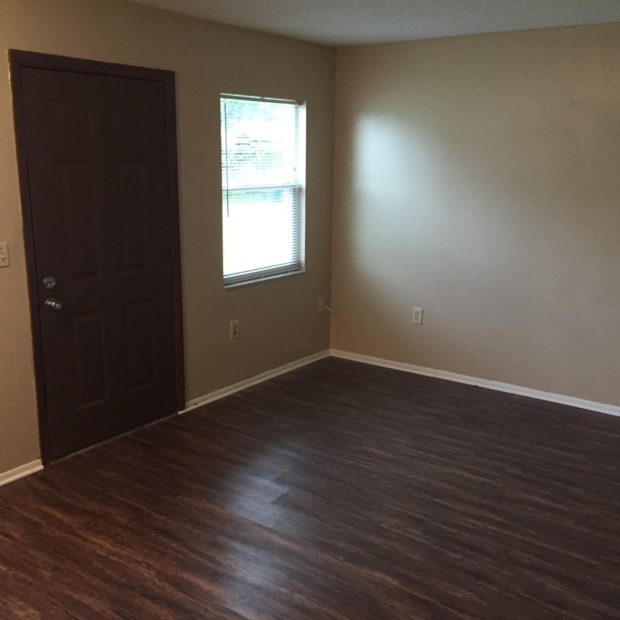 Living room. Freshly painted with new vinyl plank flooring. - 2418 S San Gully Rd