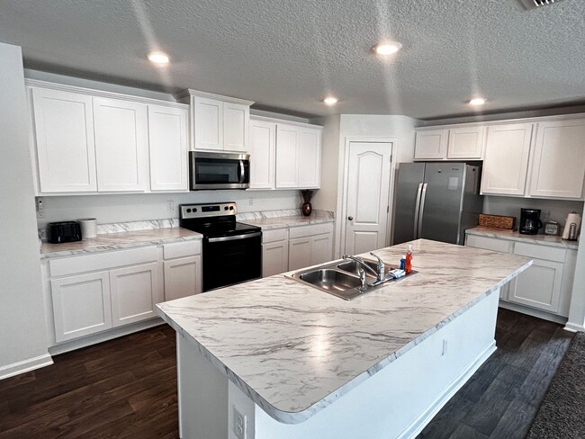 Building Photo - Picturesque Waterfront 4-Bedroom Home with...