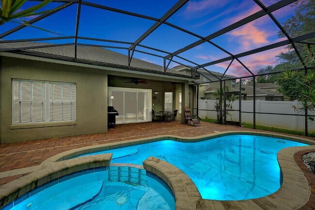 Building Photo - "Stunning 3BR Orlando Home with Private Screened Pool, Spa & Spacious Living Areas"