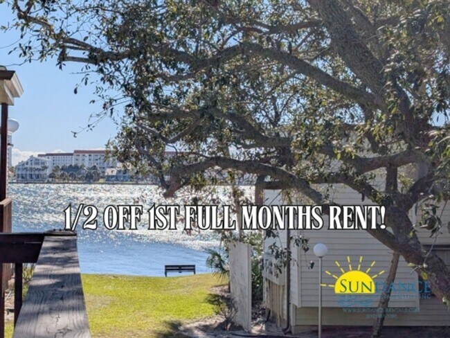 Primary Photo - Expansive waterfront covered patio off thi...