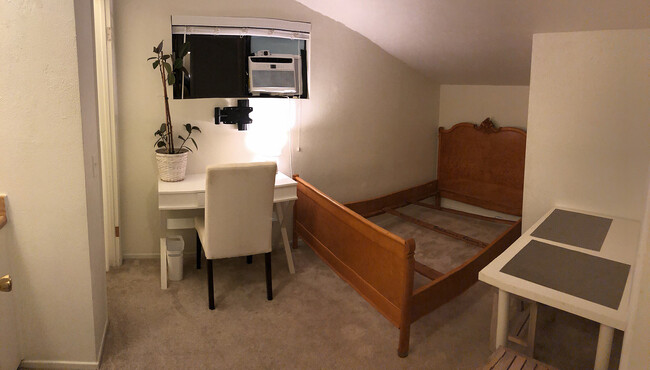 Bedroom with desk and table - 6231 Fairview Pl