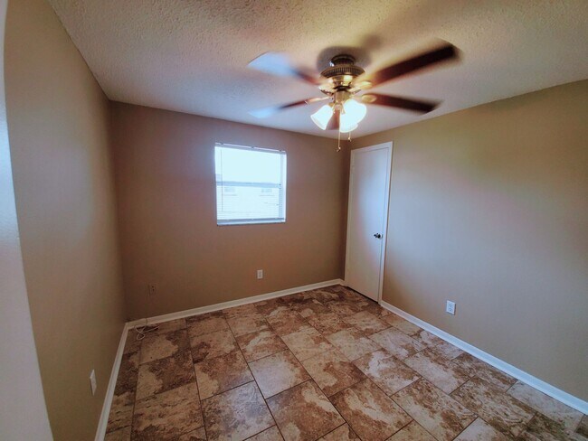 Building Photo - Three bedroom one and a half bathroom house with large yard space