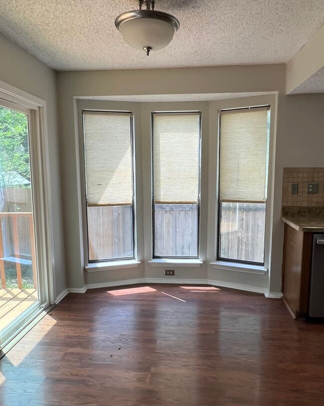 Building Photo - Corner Lot with Large Deck and Cozy Backyard