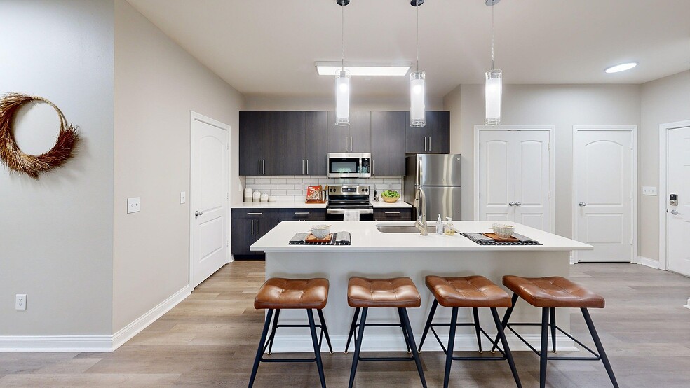 Large Kitchen with Stainless Steel Appliances - Autumn Breeze Apartments