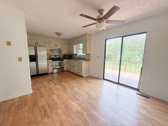 Building Photo - 2-Bedroom Home with Bonus Room & Large Wooden Deck | Pet-Friendly Near I-40 & City Lake
