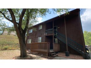 Building Photo - Tired of outdated rentals? This stunning two bedroom upper level duplex unit boasts a complete moder