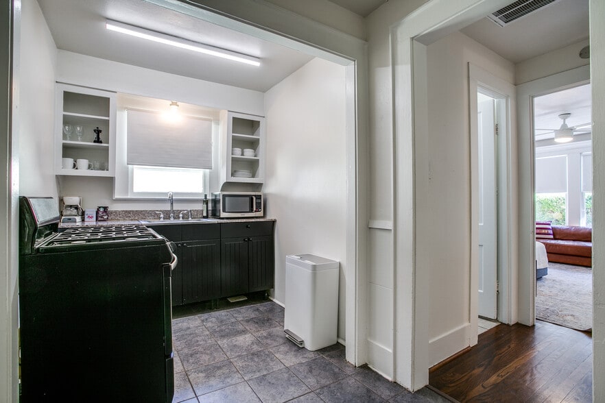 Kitchen has gas stove, storage and is separate from main area. - 600 N Montclair Ave