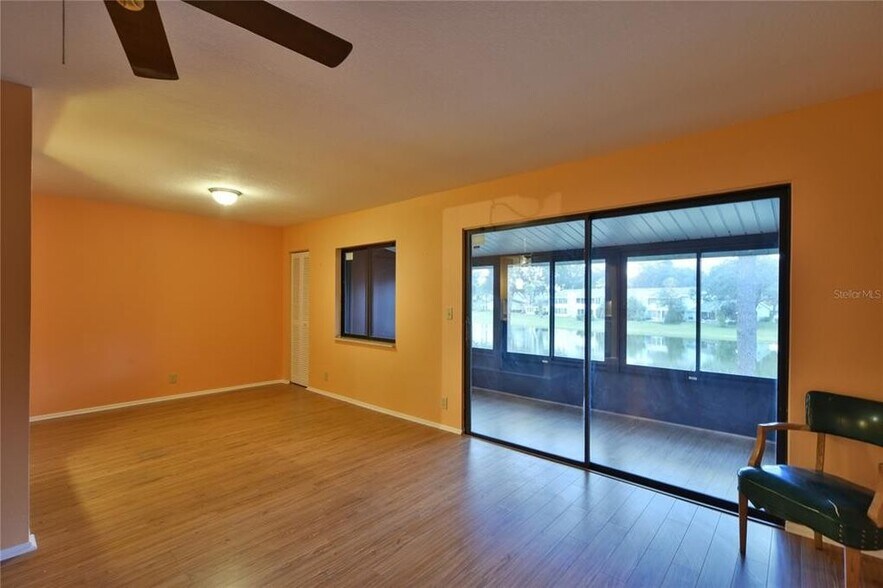 Dining area and porch with lakeview - 631 Midway Dr