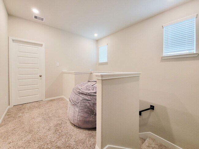 Building Photo - A true gem on a quiet corner lot, this spacious and sun-filled home is tucked away from street no...