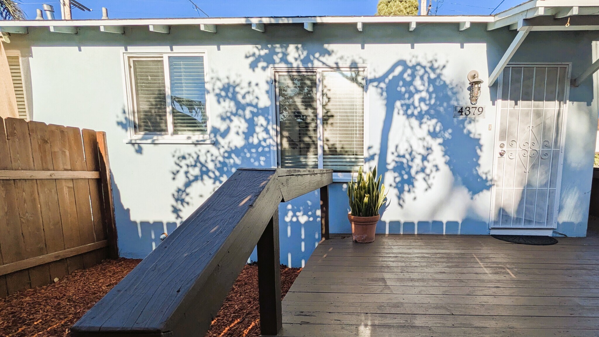 Deck pleasantly shaded during peak evening glare - 4379 Maryland St