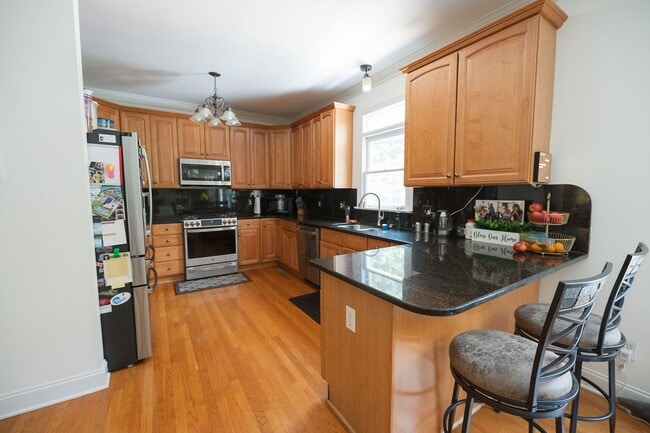 Building Photo - Spacious & Striking 3-story brick Executive 4 bedroom 4.5 bathroom home in Oak Ridge NC + Lawn ca...