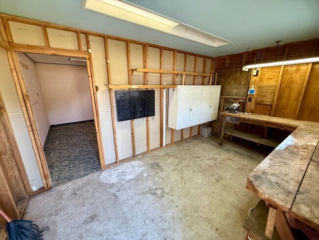 Building Photo - For Rent: 2 Bedroom, 1 Bathroom Home with Garage and Large Yard