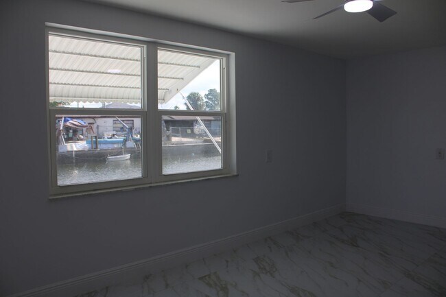 Building Photo - For Rent – 3-Bed / 2.5-Bath Deep Water Canal, Canal-Front Home with a Floating Dock,  totally ren...