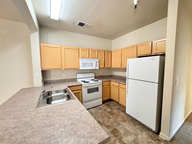 Building Photo - Home Near UNR: Spacious 4BR/4BA with Gated Access and Balcony!