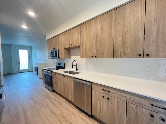 Building Photo - Modern 2-Bed, 1.5-Bath Condo with Custom Kitchen, Private Patio, and Prime Location