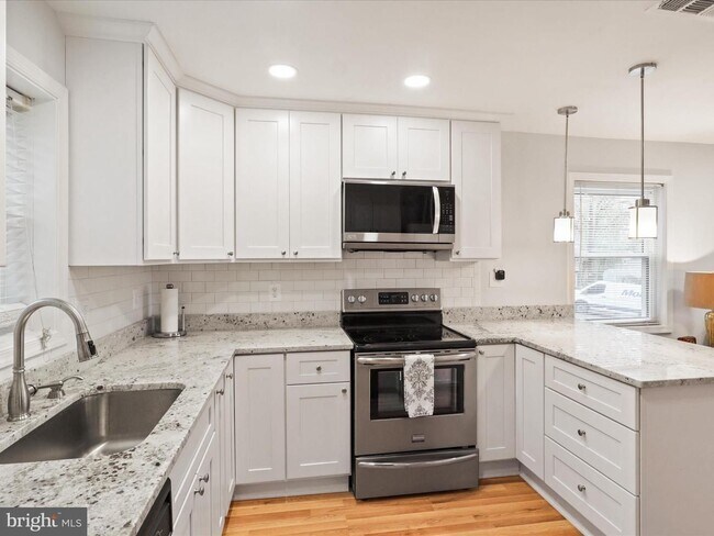 Building Photo - This home blends urban accessibility with peaceful natural surroundings.