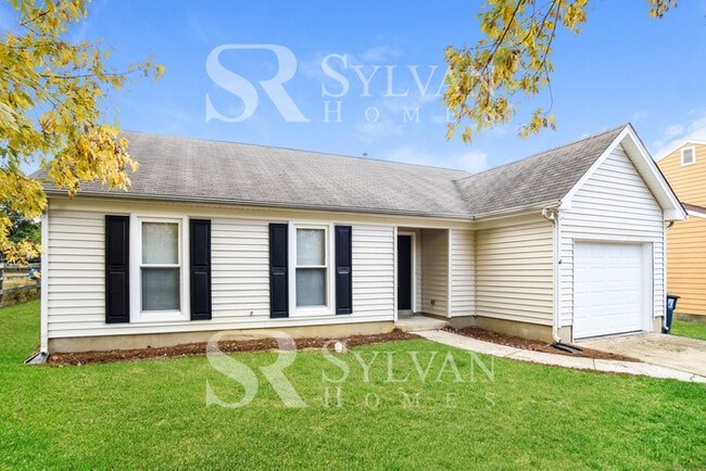 Building Photo - This home exudes a cheerful and welcoming ...