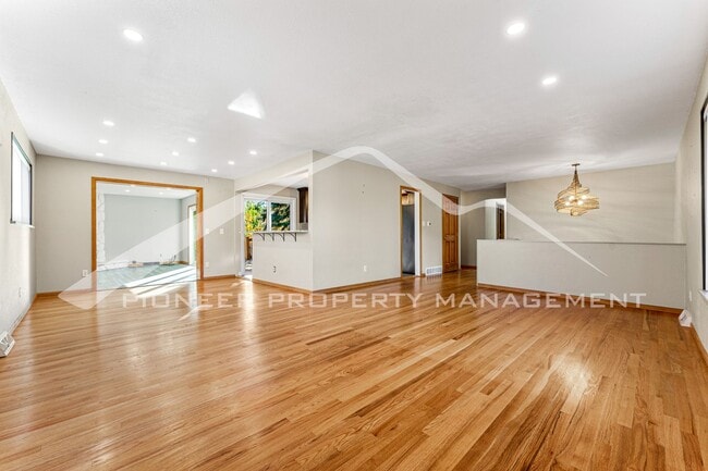 Building Photo - Spacious Home with Natural Light & Fenced Backyard