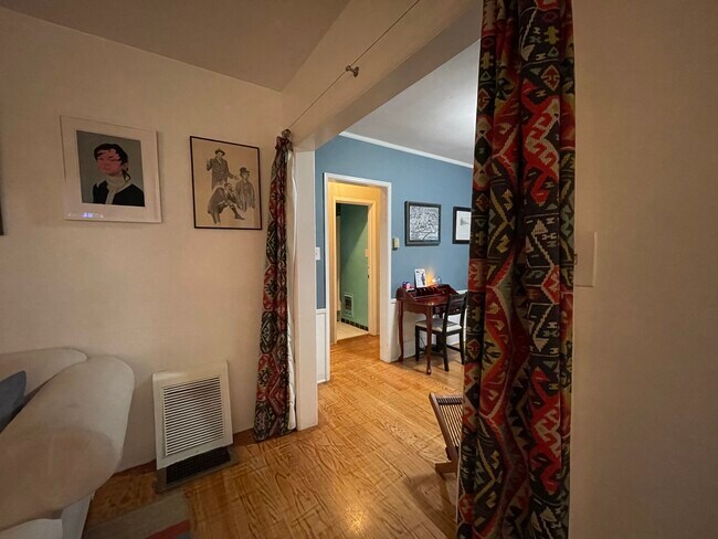 Curtains sectioning off Living Room (currently used as office) will be moved to Master BR closet - 1240 Greenacre Ave